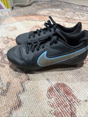 Nike youth Black Soccer Cleats with Light Blue Swoosh